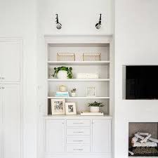 They act like an embrace, framing the seating arrangement and creating a sense of warmth. Fireplace Built In Cabinets Design Ideas