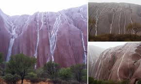 The park is recognised by unesco as a world heritage site for its natural and. Waterfalls Cascade Off Iconic Uluru In Australia S Red Centre In Pictures Daily Mail Online