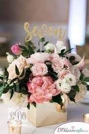 Glittery Numbers Great Diy Table Centerpiece Ideas Flower Centerpieces Wedding Wedding Floral Centerpieces Wedding Table Centerpieces