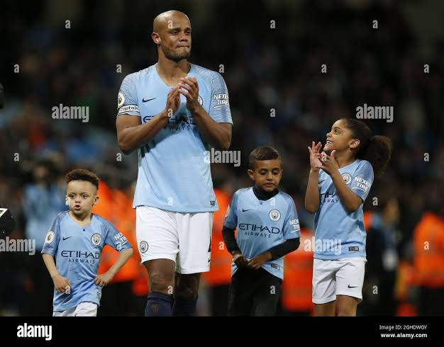 Vincent Kompany of Manchester City walks round the pitch with his children  during the Premier League match at the Etihad Stadium, Manchester. Picture  date: 6th May 2019. Picture credit should read: Andrew