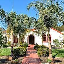 Wrought iron spanish lighting, new glass doors and wood windows to capture the light and bright valley sun. Mission Style Homes To Draw Inspiration From