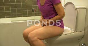 Woman with Bladder, Urine Infection sitt... | Stock Video | Pond5