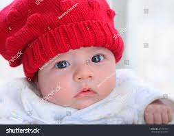 Cute Baby Red Wooll Hat Stock Photo 381042769