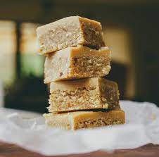 This recipe delivers a nice chewy base, with a smooth thick layer of ginger icing on top. Raw Ginger Slice Refined Sugar Free Gluten Free Raw Dessert Recipes Clean Eating Desserts Ginger Slice