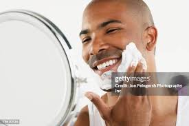 507 Young Adult Man Applying Shaving Cream Stock Photos, High-Res Pictures,  and Images