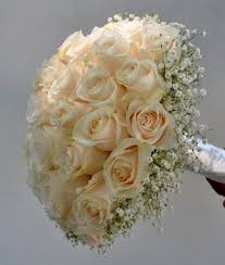 Crisp white bridal bouquets & bridesmaid bouquets + wedding decorations. White Rose Bridal Bouquet