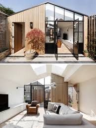 A fireplace warms the living room, giving you a cozy place to relax on chilly nights. Living Room With Skylights In A Former Timber Shed Turned House London Uk By De Rosee Sa 1710x2297 The Best Designs And Art From The Internet