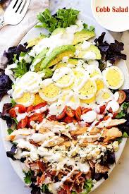 Filling and healthy salads, with meat, vegetarian or pasta salads. Cobb Salad This Classic American Main Dish Salad Is Packed With Chicken Avocado Tomatoes Bacon Blue Chee Cobb Salad Recipe Main Dish Salads Dinner Salads