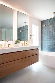 Two Bathrooms In The Same Home That Each Have A Distinct Style Modern Bathroom Main Bathroom Designs Minimalist Bathroom Design