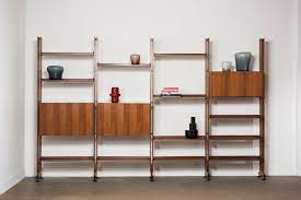 The infinito wall bookcase is a modular bookcase composed of uprights, hinged doors, flap doors and shelves, available in natural ash, black stained. Franco Albini Lb10 Bookcase Casati Gallery