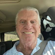 White cream filled doughnuts with powdered sugar or chocolate icing in Tulsa