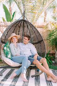Couples seem to get the swinger's gallery is the best thing that you can find. Young Couple Enjoy Time Together While Sitting Outside On A Wicker Swing Chair By Rzcreative At Home Couple Stocksy United
