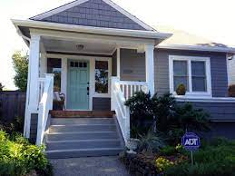 Resist use of a clean or bright white paint color for trim because it will look too bright and harsh. Benjamin Moore Chelsea Gray Siding And Wyeth Blue Front Door Exterior Paint Colors For House House Exterior House Painting