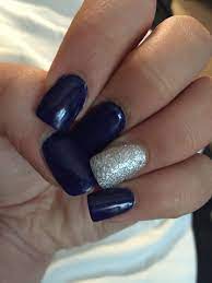 Acrylic Nails Done With Dark Navy Blue And Silver Sparkles Accented On The Ring Finger Navy And Silver Nails Navy Blue Nails Prom Nails Silver