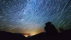 Timelapse Of Moving Star Trails In Night Sky The Milky Way Galaxy Rotating Over The Mountain Range In Summer Time H Star Trails Night Skies Milky Way Galaxy