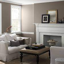 This formal living room is painted white and is brought to life by gold accents, seen in the light fixture, ottoman and artwork. Guide To Warm And Cool Paint Colors Benjamin Moore