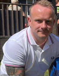 Moment policeman shoves a man 11 times and calls him a 'd***head' in  furious bust-up after he mounted the kerb while parking his patrol car