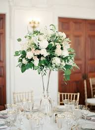 Trending High Centerpieces That Ll Wow Your Guests Wedding Floral Centerpieces Tall Wedding Centerpieces Wedding Table Centerpieces