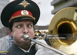 Russian policeman plays the trombone during a St. Patrick's Day... News  Photo