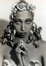 Florence Mills in 1923. She was born in 1895, to ex- slaves in a  Washington, D.C. slum. By the age of four, she was performing