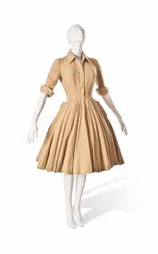 Introduction and designer profiles by alexander fury. A Christian Dior Mustard Wool Day Dress
