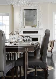 She used this chair in all of her apartments, sometimes in the dining room, sometimes at a desk. Brown French Dining Table With Gray Leather And Fabric Dining Chairs French Dining Room
