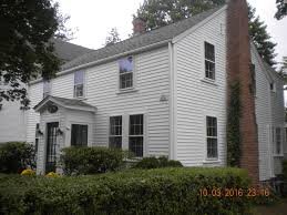 White painted brick chimney exterior. Exterior Painting By Certapro House Painters In Woburn Ma White Siding And Red Brick Chimney Home Woburn