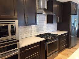 Modern kitchen backsplashes, 15 gorgeous kitchen backsplash ideas. Dark Shaker Cabinets White Subway Tile Backsplash Quartz Cou Subway Tile Kitchen Dark Cabinets Backsplash With Dark Cabinets Backsplash Kitchen Dark Cabinets