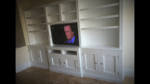 You can purchase a motorized tv lift mechanisms that starts at $650 and install it inside an existing cabinet or on a wall behind a cabinet. How To Build Tv Wall Cabinets Youtube