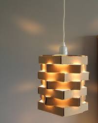 See more ideas about diy hanging light, diy hanging, diy lighting. Poppytalk Diy Cardboard Pendant Light Diy Light Fixtures Diy Chandelier Diy Cardboard