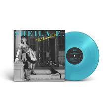 Walk in a very long full skirted light blue vinyl coat. Sheila E In The Glamourous Life 1 Lp Electric Light Blue Translucent Vinyl Rhino