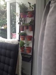 Turn your flowers or plants into a work of art with a vertical garden planter, perfect for small spaces and urban gardening. Ikea Towel Hanger Transformed Into A Vertical Garden Ikea Hackers
