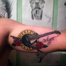 Repost from @annarohaly got a guns n' roses tattoo? 40 Guns And Roses Tattoo Designs For Men Hard Rock Band Ink Ideas