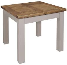 This table offers a split use where one end can be used as a desk, hidden from sight when dining the traditional way to extend a formal dining table is to insert extra 'leaves', or segments. Regatta Grey Painted Square 90cm 130cm Extending Dining Table Cfs Furniture Uk
