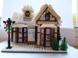 A Christmas Cottage A Lego Creation By Holly Wood Mocpages Com Lego Gingerbread House Lego House Lego Christmas
