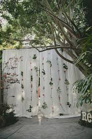 Create a beautiful hanging flower garland perfect for home decor or photo backdrop. Flower Backdrop The Perfect Diy Wedding Project