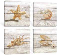 There are beautiful options that feature seashells, palm trees, fish, and more. Amazon Com Sumgar Beach Wall Art Bathroom Coastal Decor Ocean Pictures Rustic Seashell Canvas Paintings Yellow Starfish Prints Beige Hawaii Artwork Set Of 4 Bedroom Wall Decorations 12x12 Inch Posters Prints