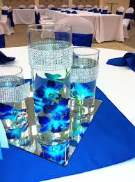 Pin By World Of Bridal On Themed Wedding Ideas Orchid Centerpieces Wedding Blue Centerpieces Wedding Centerpieces
