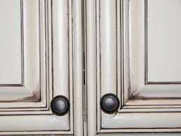 Using a dark color on the base cabinets and white on the uppers gives the illusion that it's way bigger, too. Tips On Glazing Kitchen Cabinets Diy Home Improvement Forum