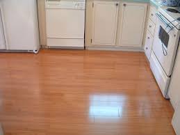 Using a laminate bit, run your router around the edges of the countertops to trim off the extra laminate. Laminate Flooring In Kitchens Do It Yourself Installation