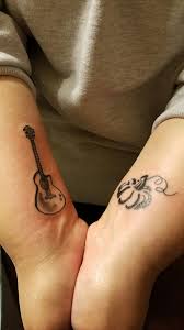 Wrist Pumpkin Tattoo And Guitar Tattoo Pumpkin Tattoo Tattoos Guitar Tattoo