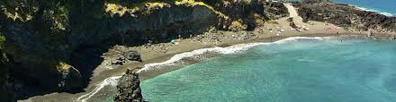 Seixal beach on madeira island is a stunning stretch of black sand with an incredible mountain backdrop featuring ridges and waterfalls overlooking the beach! Laje Beach In Seixal Madeira Island Beaches