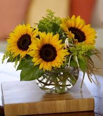 Pretty And Simple Arrangement Sunflowers Solidaster And Lemon Leaves In Glass Bub Sunflower Floral Arrangements Sunflower Centerpieces Sunflower Arrangements