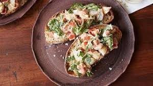 Opt for a classic bruschetta recipe or an inventive spin on the signature appetizer with ideas from food network chefs. How To Make Giada S Shrimp And Arugula Bruschetta Food Network Youtube