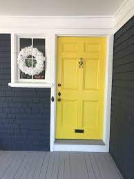 Simply white went sort of gray in our house. Blue House Yellow Door Yellow Doors Benjamin Moore Exterior Blue House Yellow Door