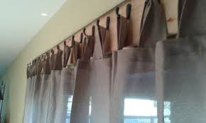 tab top curtains hung from hooks on