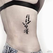 A Black Lavender Tattoo On The Right Rib Cage By Queenie Lavender Tattoo Tattoos Flower Tattoos