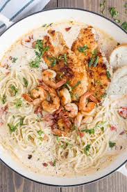 A Classic Italian American Dish Made With Shrimp And Chicken In A Creamy Carbonara Sauce Chicken Carbonara Recipe Carbonara Recipe Chicken And Shrimp Recipes