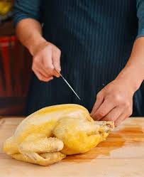 Working with one wing at a time, pull the wing away from the body and cut through the joint where the wing is attached. How To Cut A Whole Chicken Chinese Style The Woks Of Life
