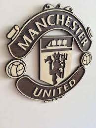 With sports, including soccer, at a standstill, it's a good time to delve into the history and culture of the. Manchester United Wooden Crest Wall Hanging Manchester United Manchester United Logo Manchester United Wallpaper